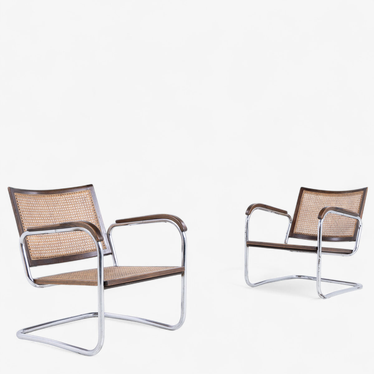 S102 - Pair of rare easy chairs in stained beech