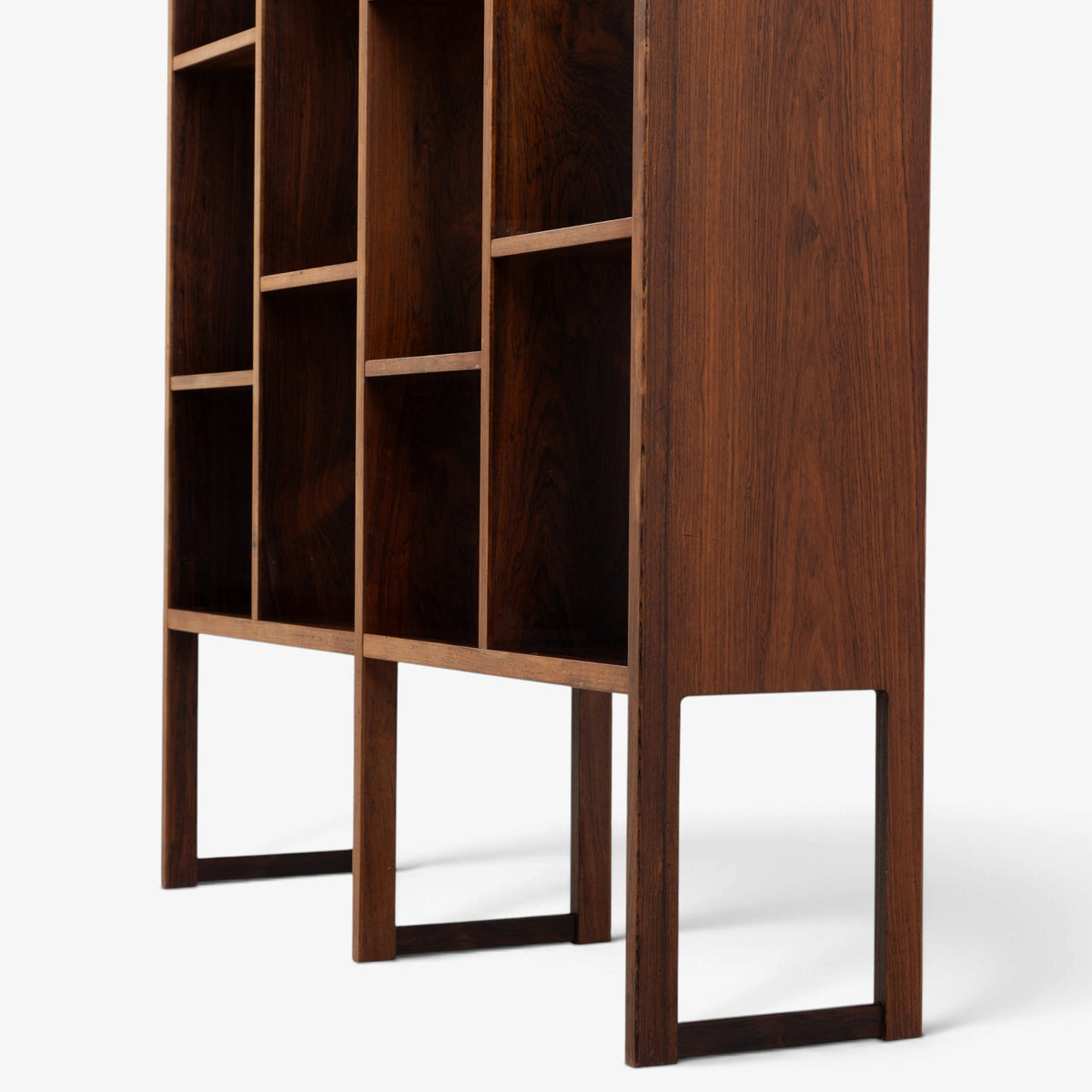 Freestanding shelving unit in rosewood
