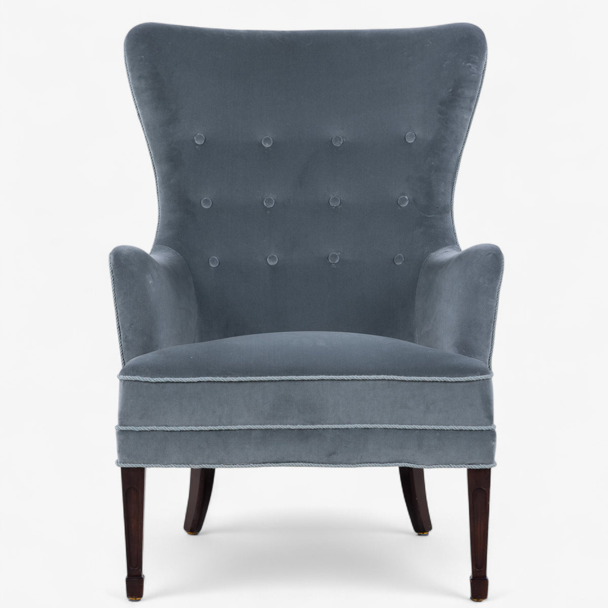 High-backed easy chair in textile