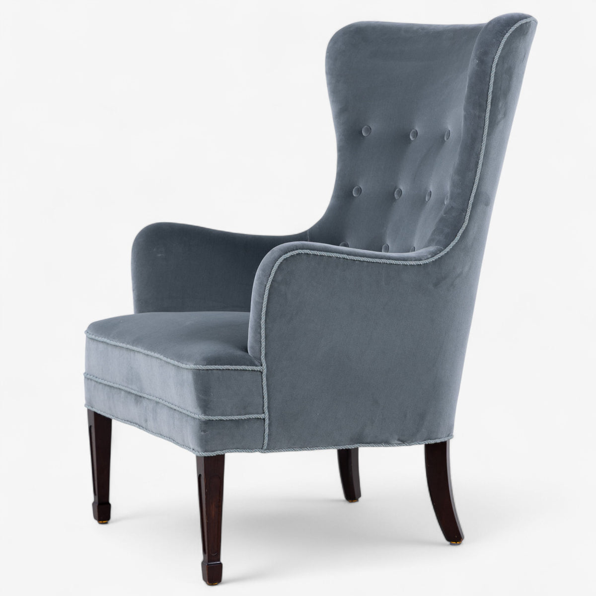 High-backed easy chair in textile