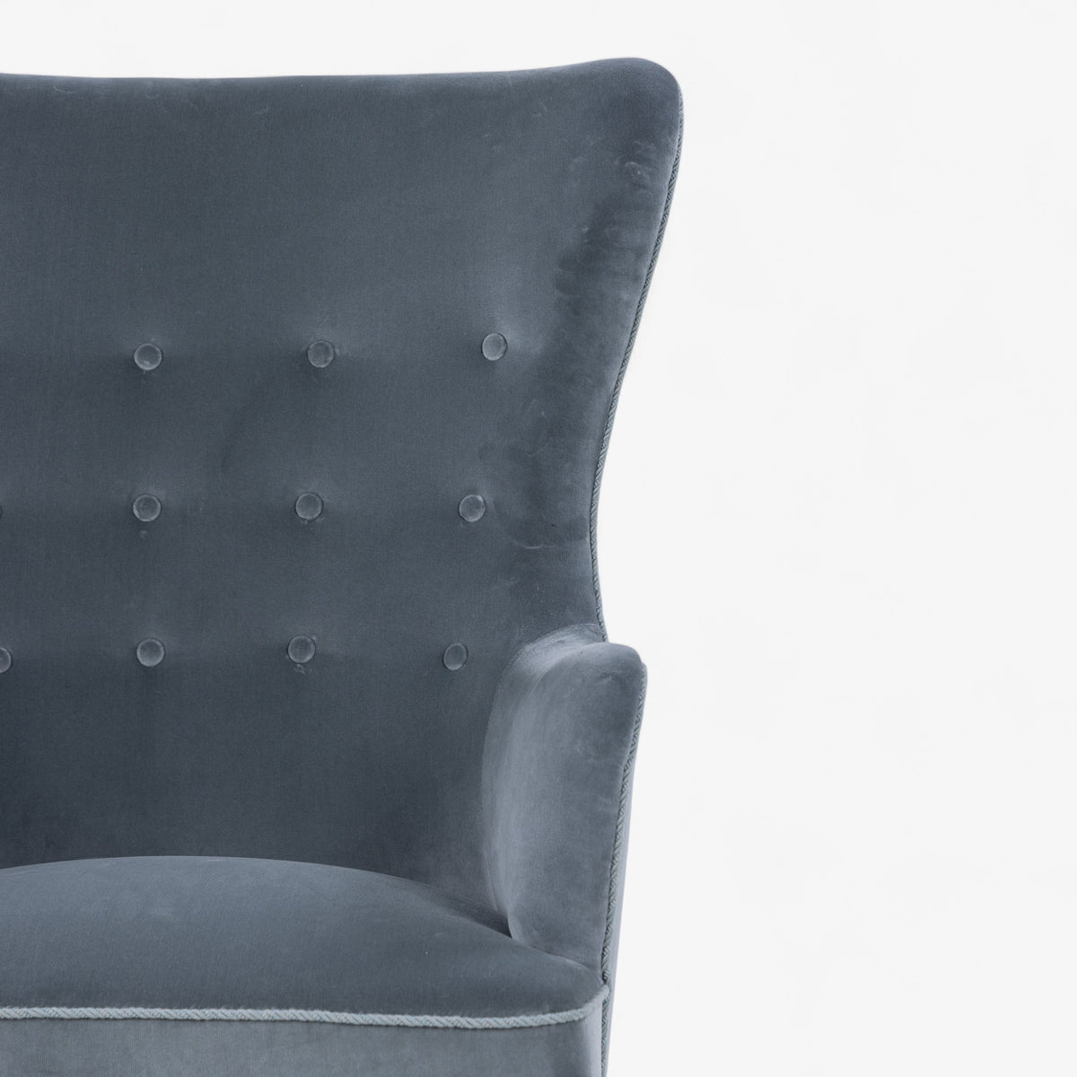 High-backed easy chair in textile