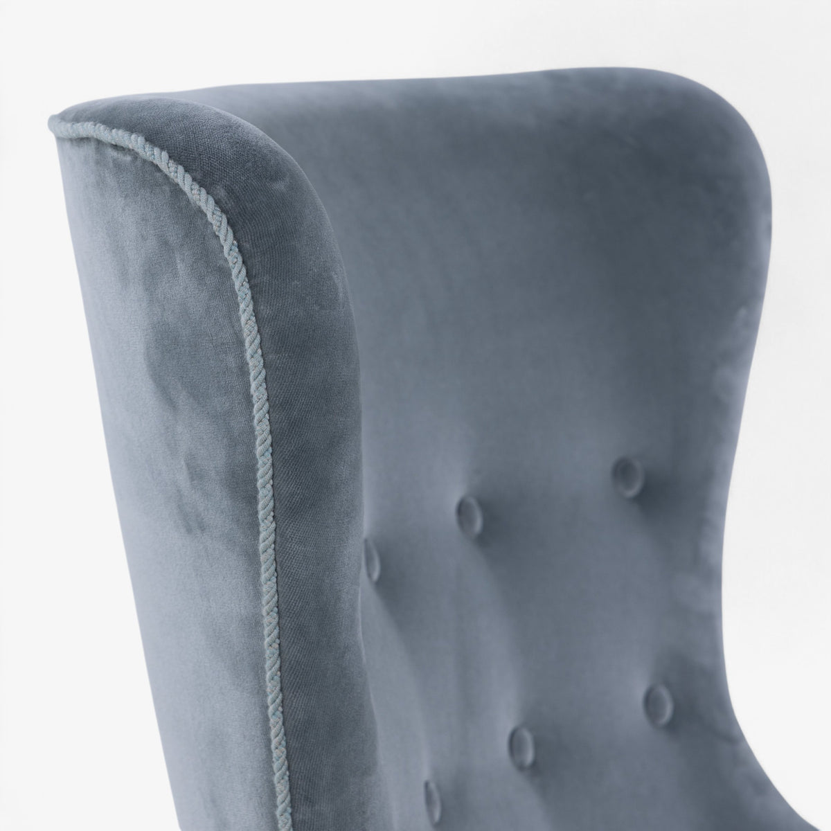 High-backed easy chair in textile