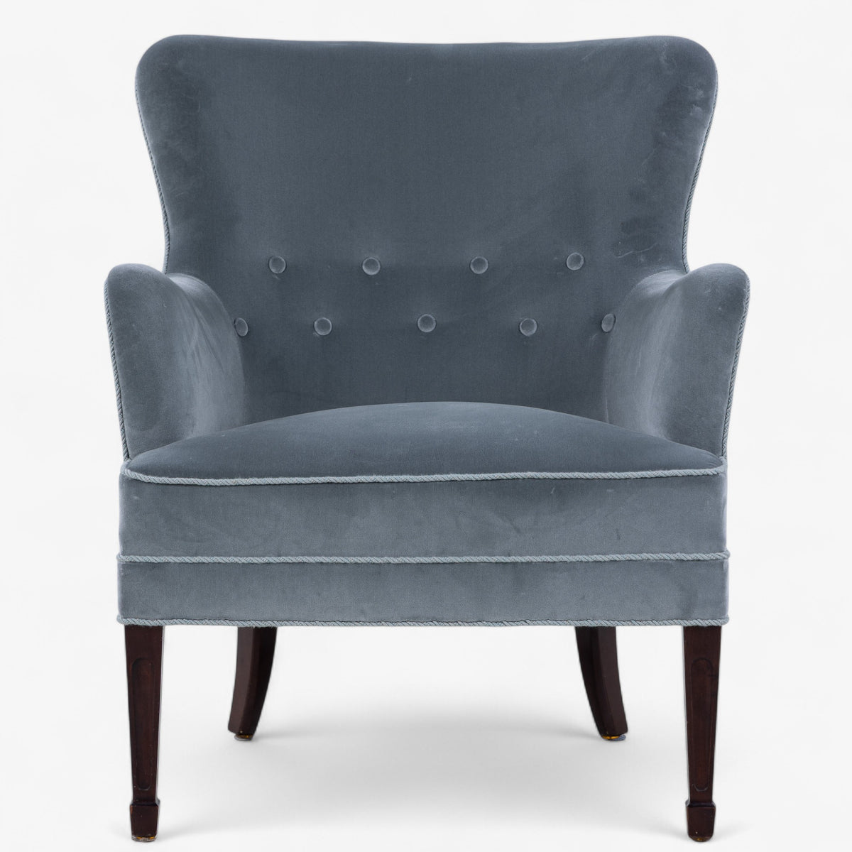 Low-backed easy chair in textile