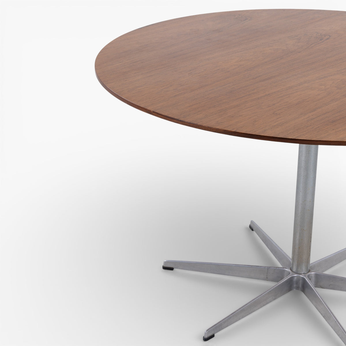 Round dining table in rosewood