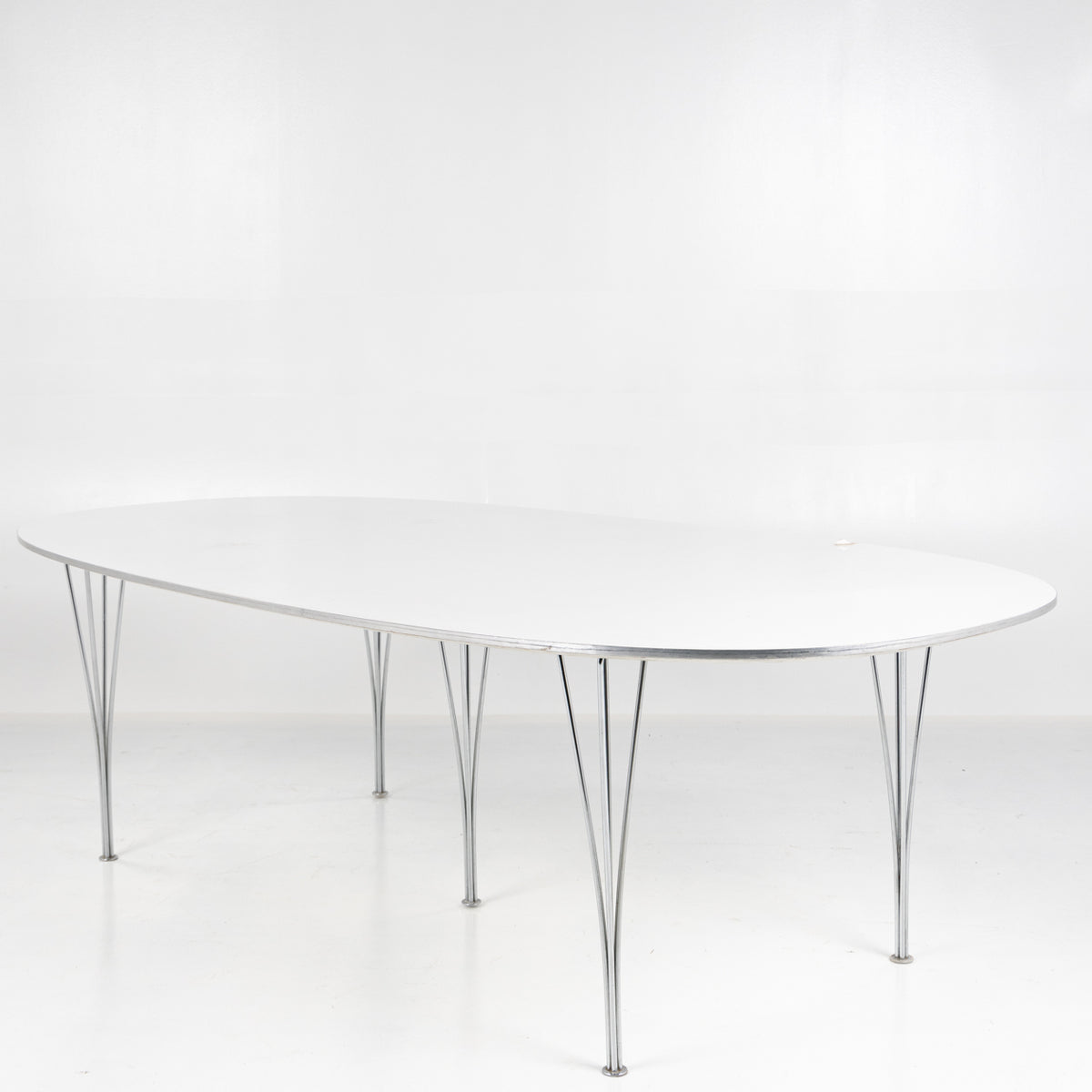 Superellipse dining table in white laminate