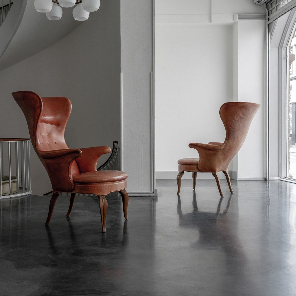 A pair of rare 'Wingback' armchairs