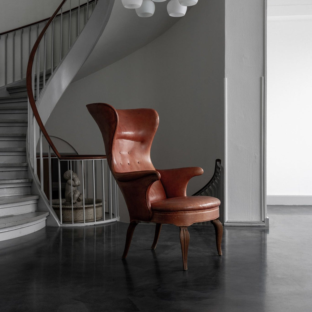 A pair of rare 'Wingback' armchairs