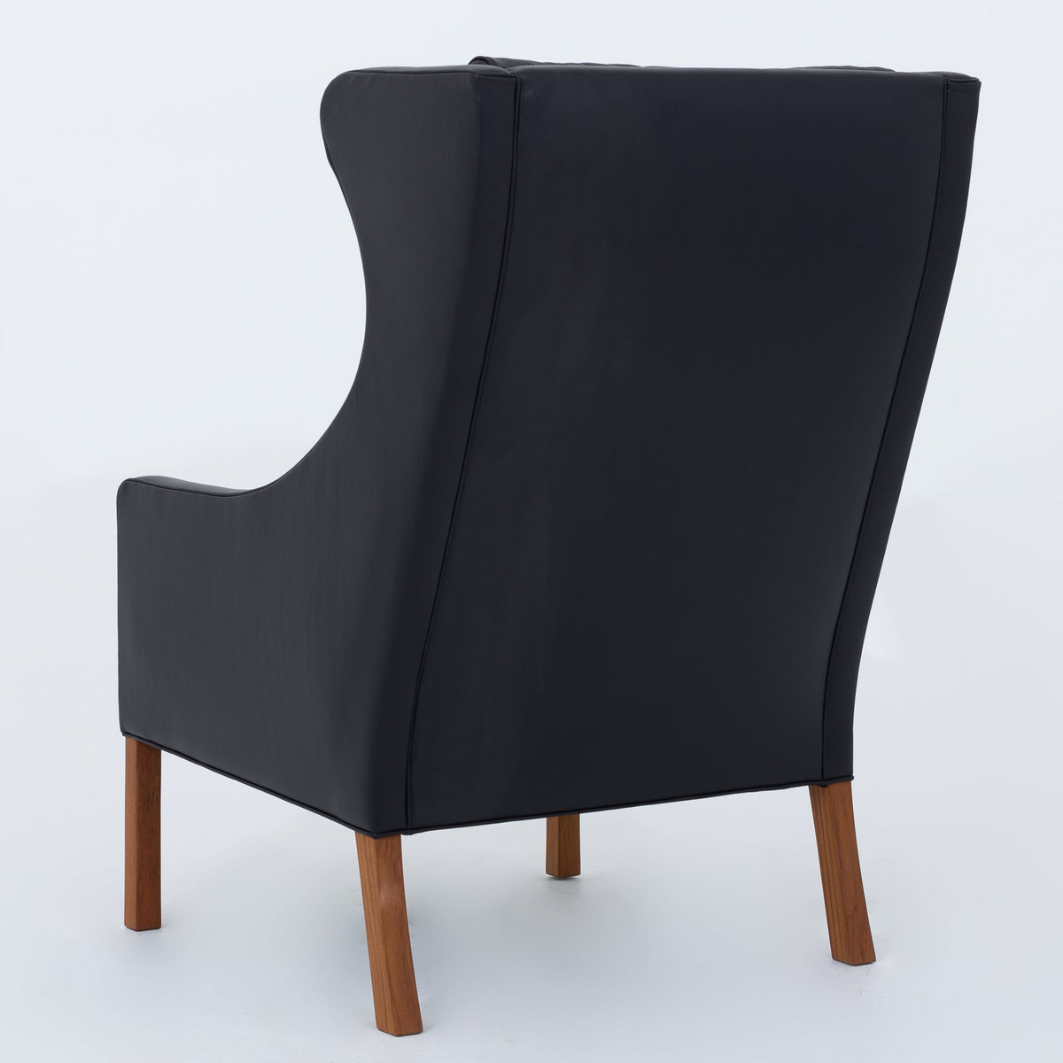 BM 2204 - A pair of Wingback Chairs in black leather