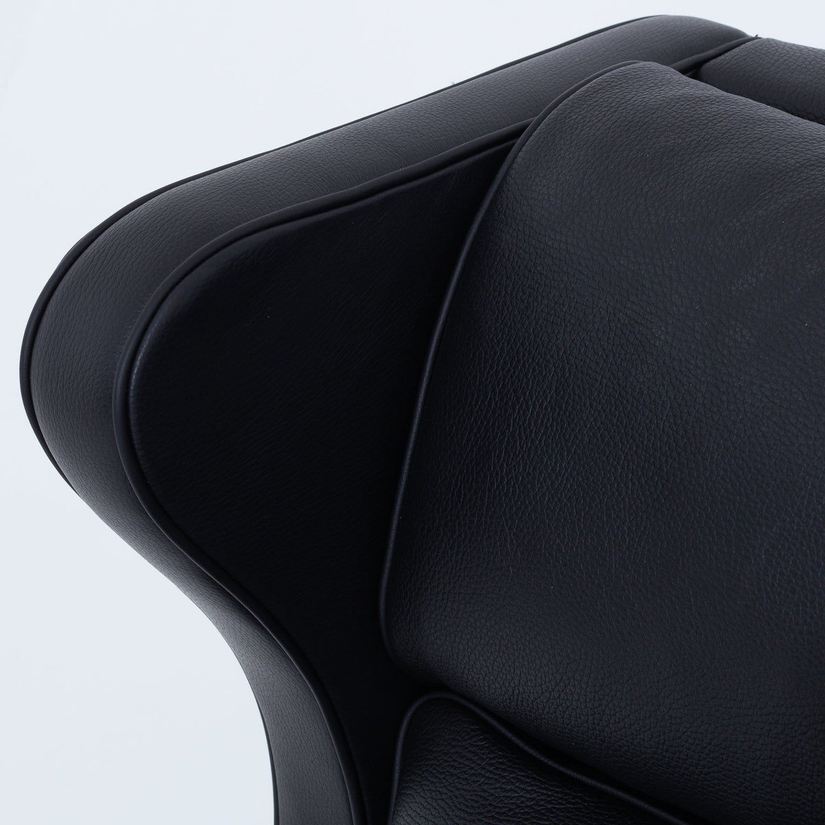 BM 2204 - A pair of Wingback Chairs in black leather