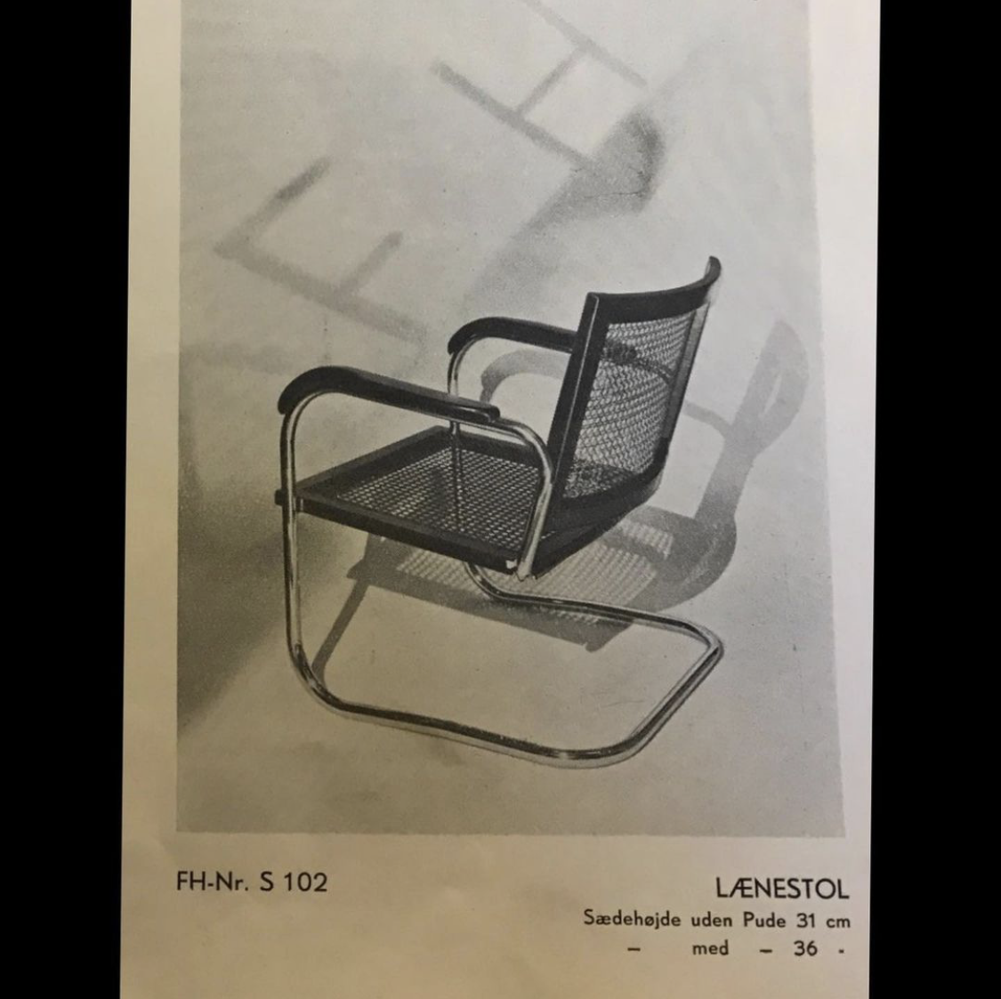 S102 - Pair of rare easy chairs in stained beech