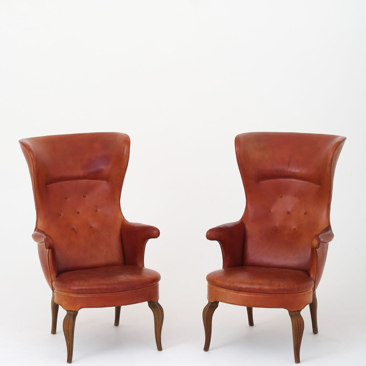 A pair of rare 'Wingback' armchairs