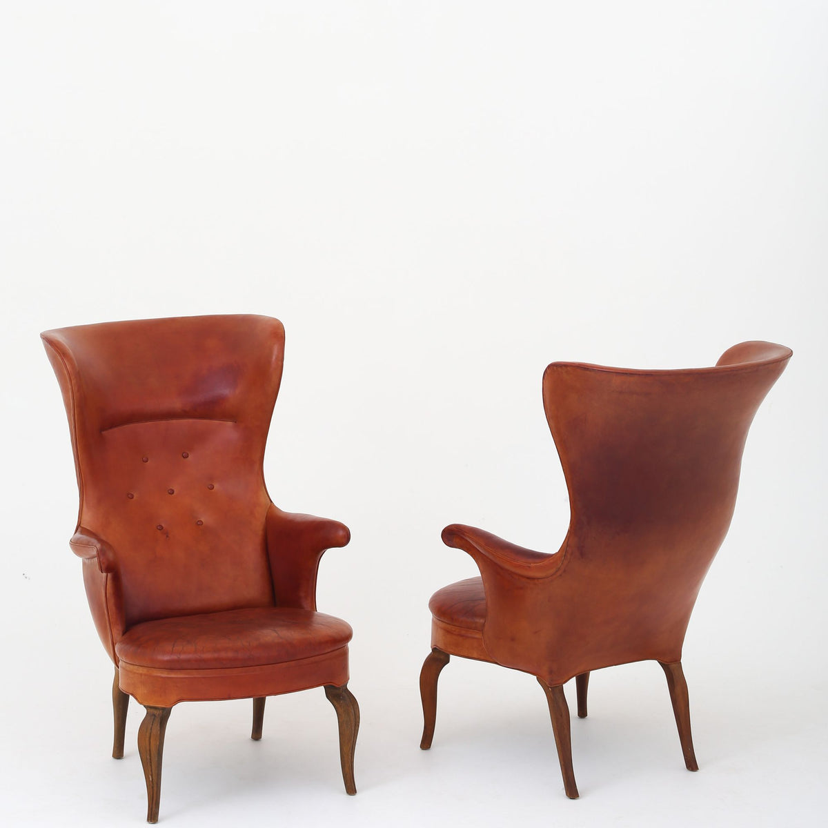 A pair of rare 'Wingback' armchairs