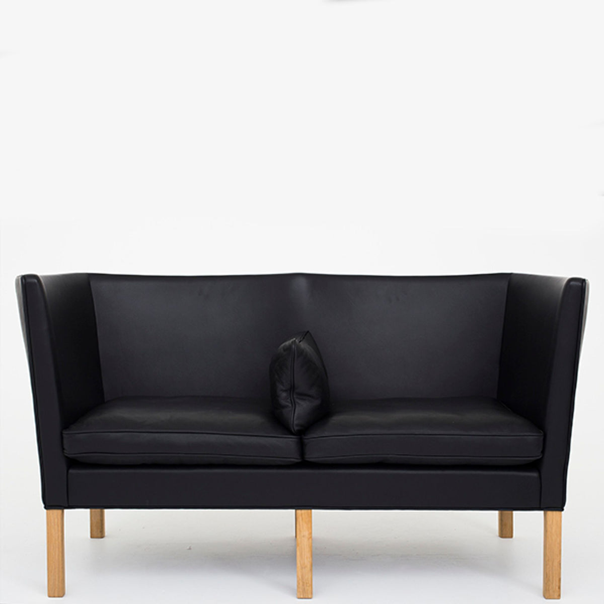 BM 2214 – Reupholstered sofa in black leather