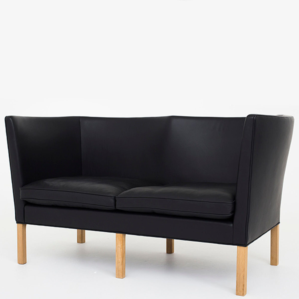 BM 2214 – Reupholstered sofa in black leather