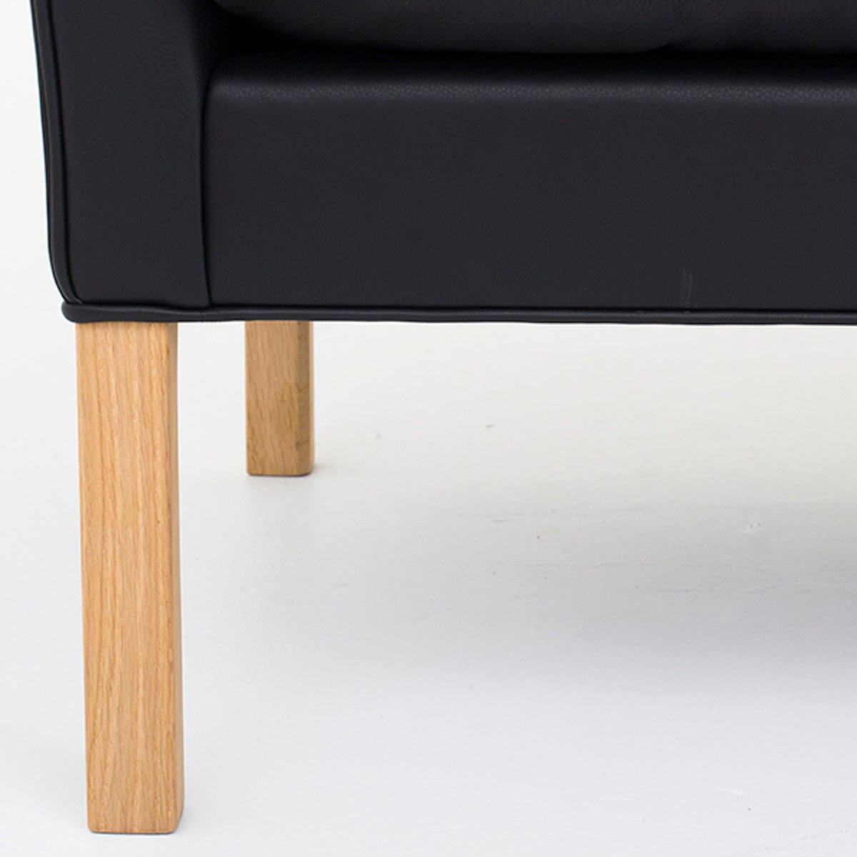 BM 2214 – Reupholstered sofa in black leather